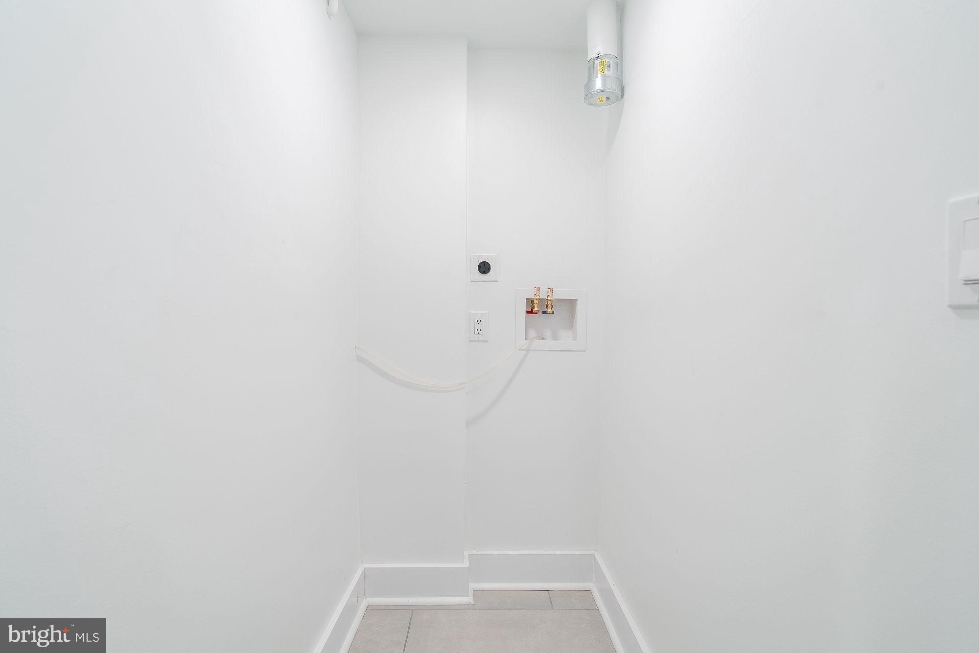 36 Channing Street Northwest, Unit A Washington, DC 20001 - Photo 21 of 33 a view of small space with racks on the wall