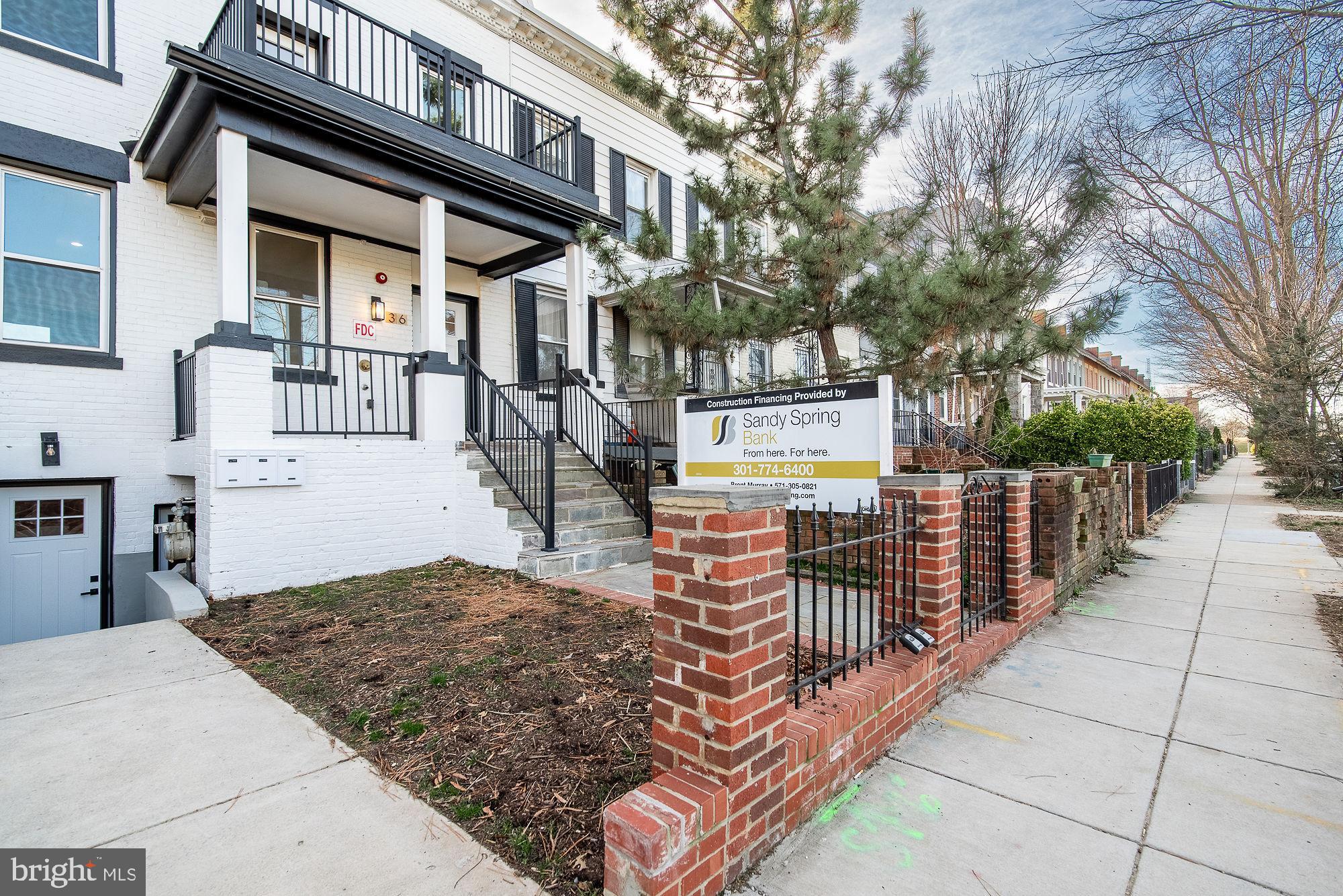 36 Channing Street Northwest, Unit A Washington, DC 20001 - Photo 23 of 33 a view of a house with a wooden fence