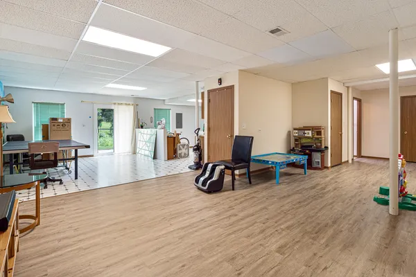 a view of a livingroom with furniture and a flat screen tv