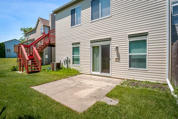 a view of a house with a backyard