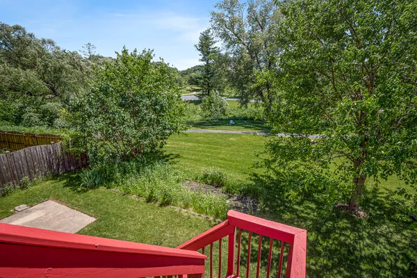 a view of a yard with an outdoor seating