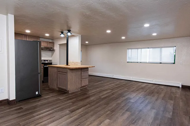 an open kitchen with a sink and dish washer