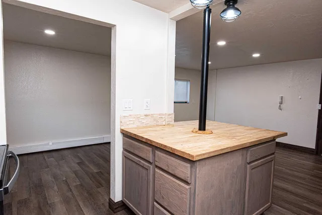 a view of kitchen island with wooden floor