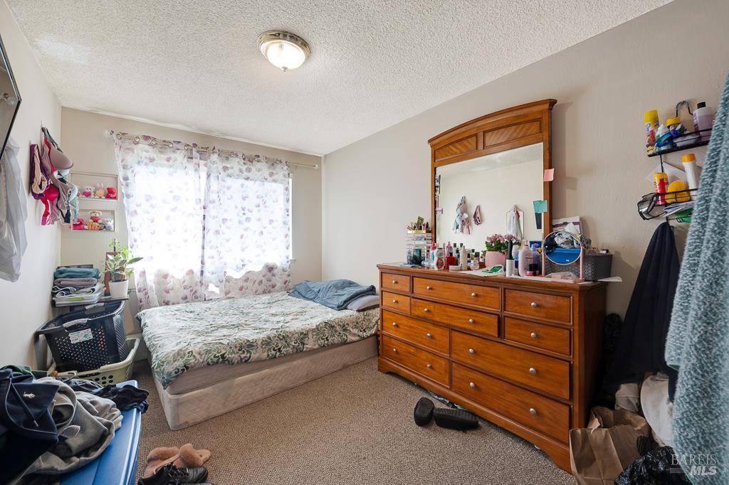 2313 Heidi Place Santa Rosa, CA 95403 - Photo 12 of 14 a bedroom with a bed and a dresser in it