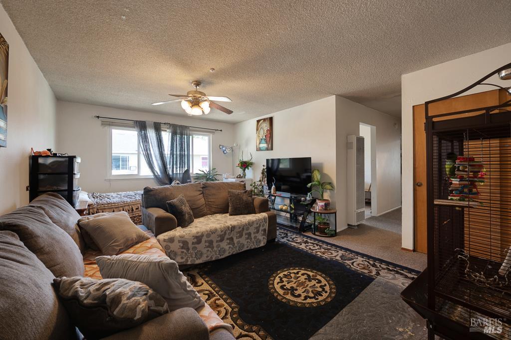 2313 Heidi Place Santa Rosa, CA 95403 - Photo 8 of 14 a living room with furniture and a flat screen tv