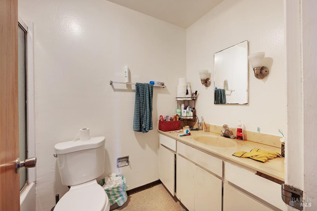 2313 Heidi Place Santa Rosa, CA 95403 - Photo 10 of 14 a bathroom with a sink vanity mirror and toilet