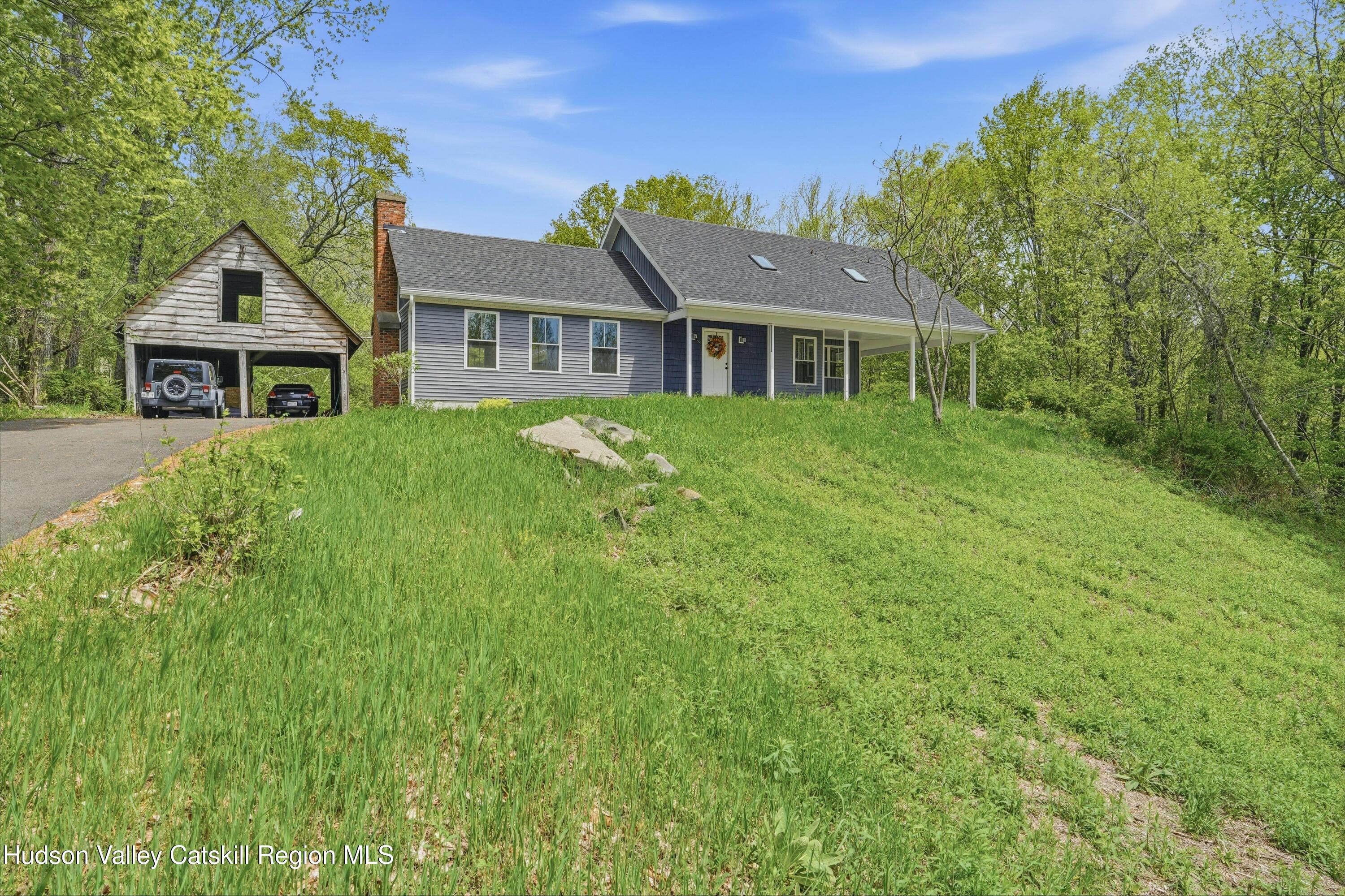 757 Taborton Road Sand Lake, NY 12153 - Photo 26 of 32 a front view of a house with a garden
