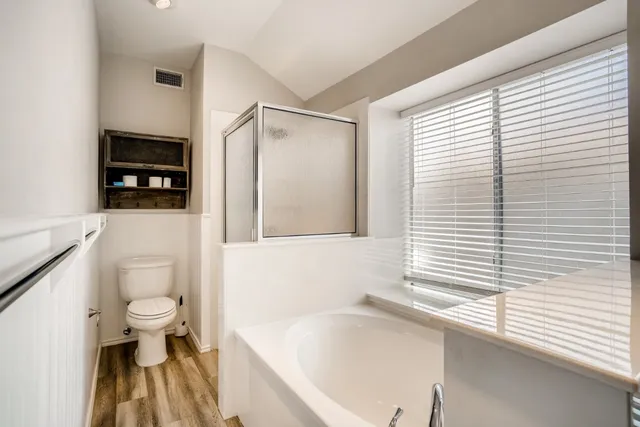 a bathroom with a sink a toilet and a bathtub