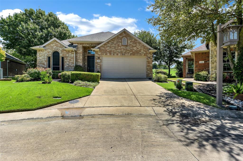 1396 Sagebrook Drive Fairview, TX 75069 - Photo 1 of 1 a front view of a house with a yard and garage