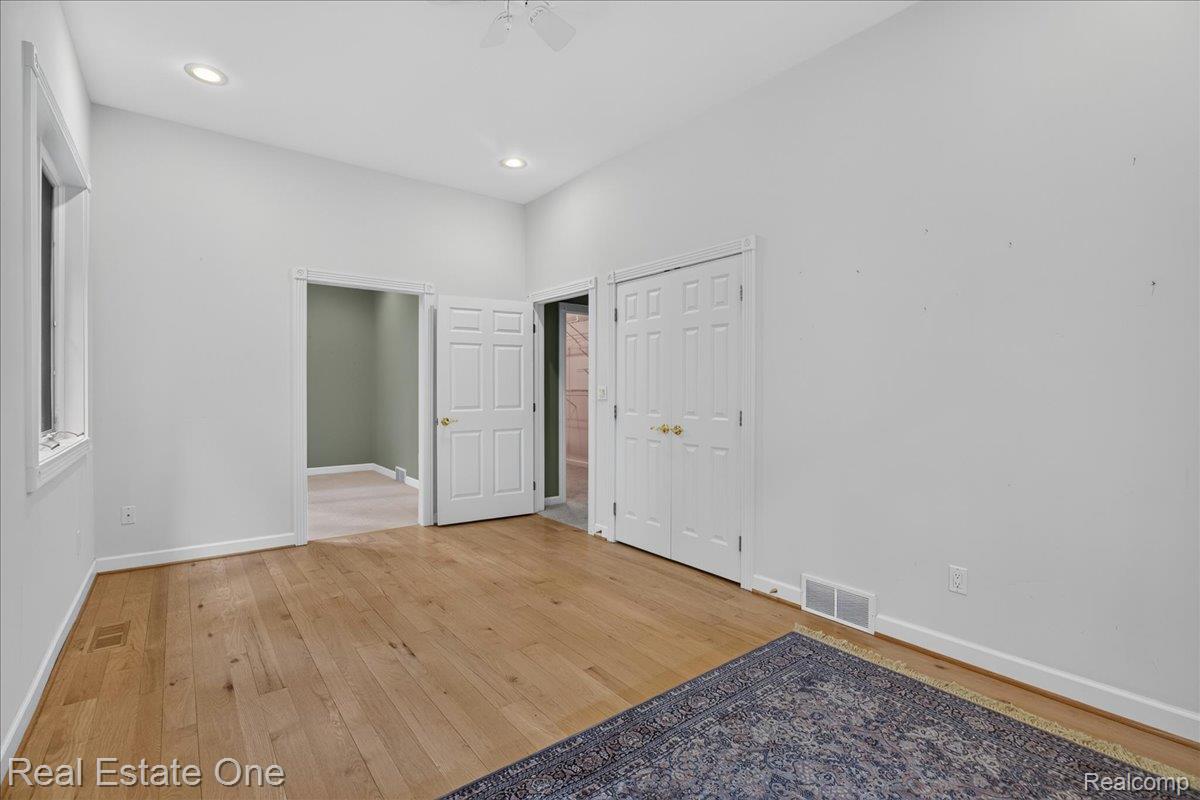 425 Courtney Road Leonard, MI 48367 - Photo 50 of 89 Spacious room featuring wood-finish flooring, vaulted ceilings, and recessed lighting