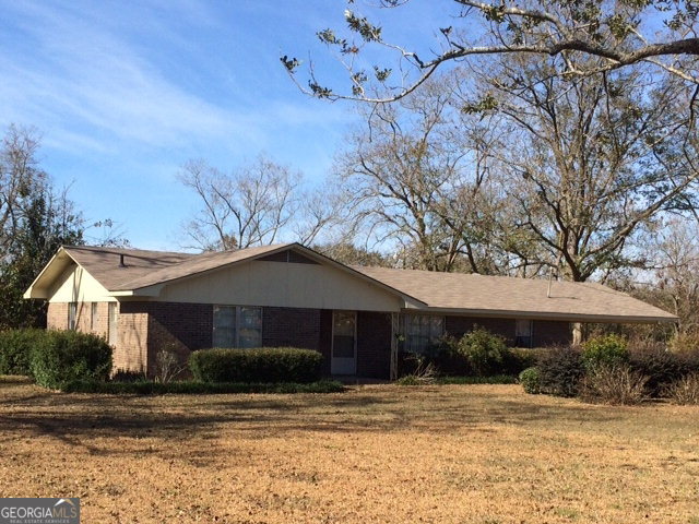 1206 Bell Telephone Road Hazlehurst, GA 31539 - Photo 1 of 1 a front view of a house with a yard