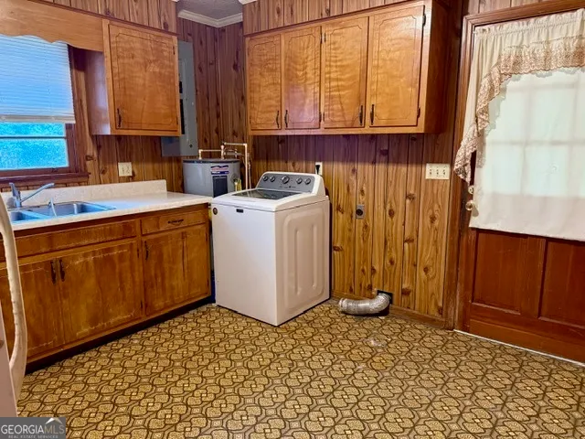 a view of a kitchen with refrigerator and cabinet