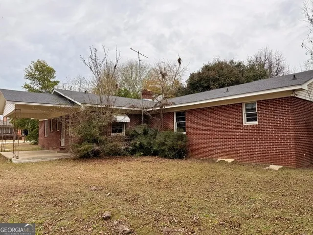 a backyard of a house with lots of green space