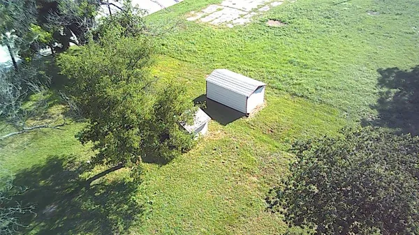 a view of a backyard with sitting area