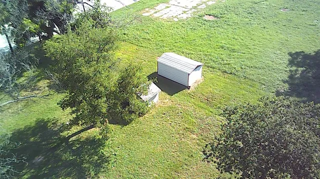 a view of a backyard with sitting area