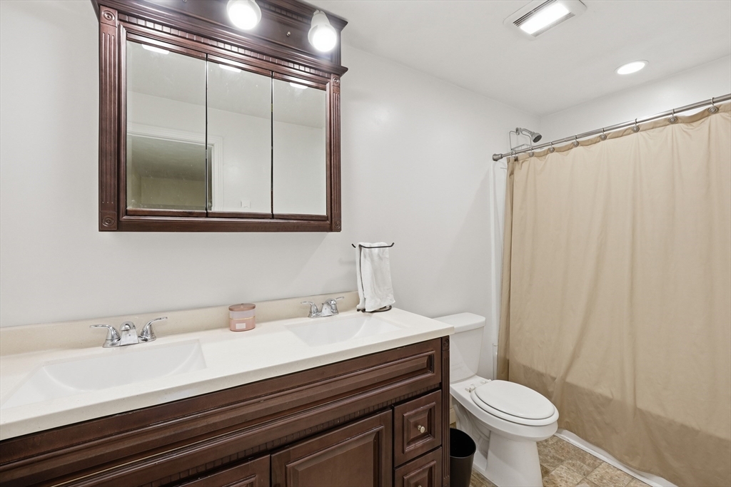 5 Swan Avenue, Unit B Worcester, MA 01602 - Photo 18 of 25 a bathroom with a sink and a mirror