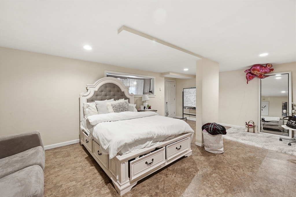 5 Swan Avenue, Unit B Worcester, MA 01602 - Photo 20 of 25 a bed room with a bed and a potted plant