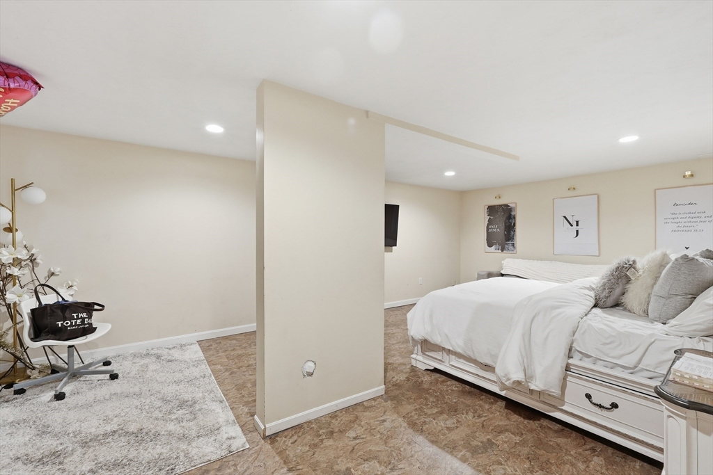 5 Swan Avenue, Unit B Worcester, MA 01602 - Photo 21 of 25 a bedroom with a bed and a potted plant