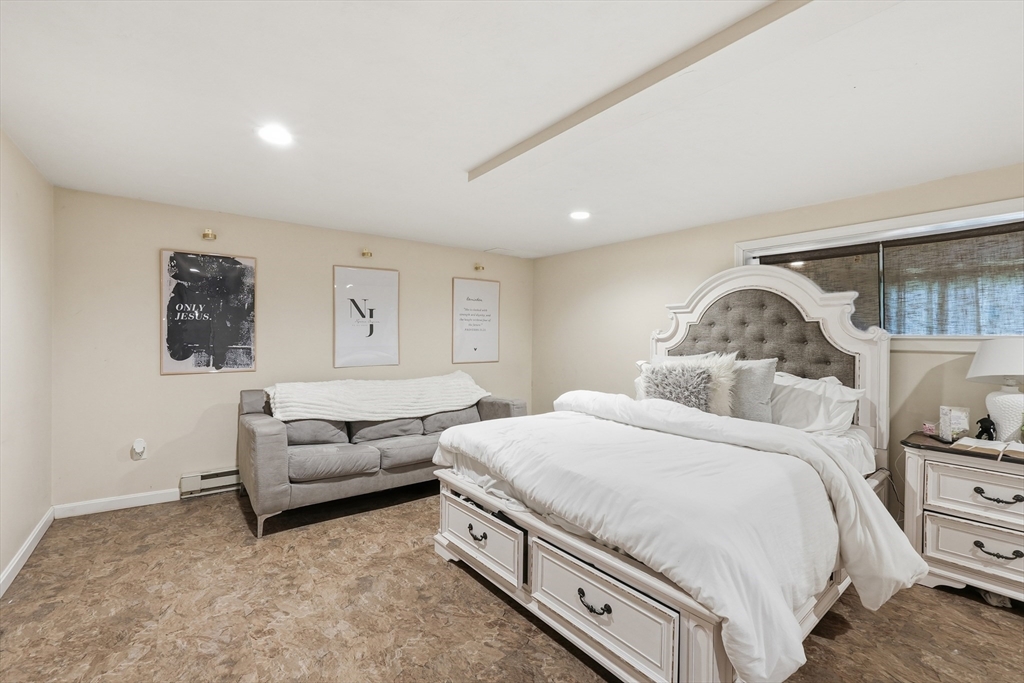 5 Swan Avenue, Unit B Worcester, MA 01602 - Photo 25 of 25 a bedroom with a bed and a couch
