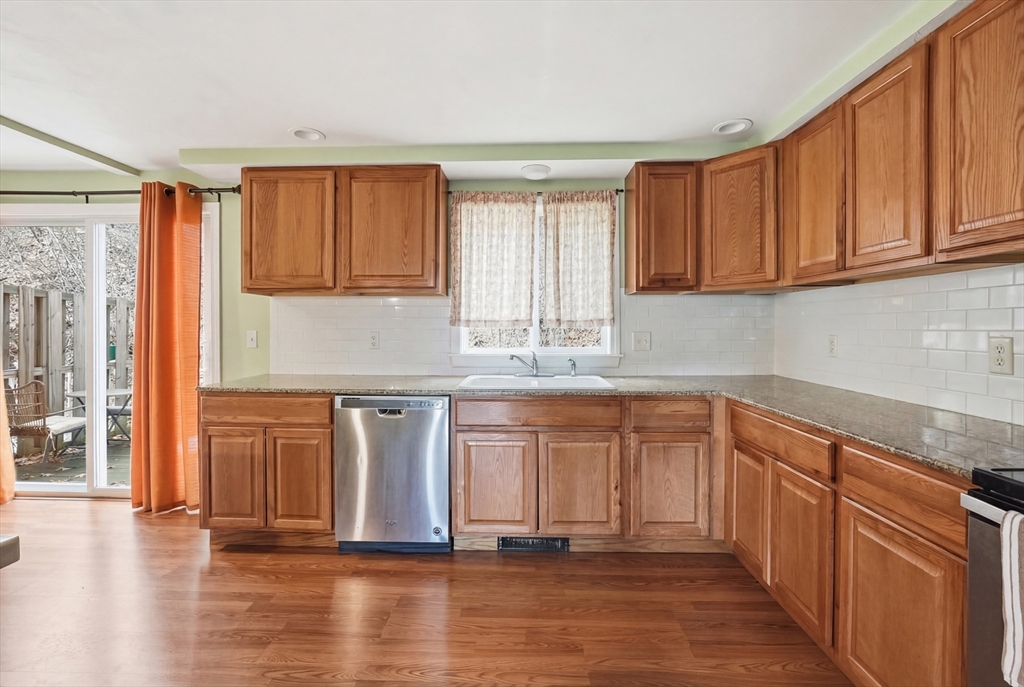 5 Swan Avenue, Unit B Worcester, MA 01602 - Photo 10 of 25 a kitchen with stainless steel appliances granite countertop a refrigerator and sink