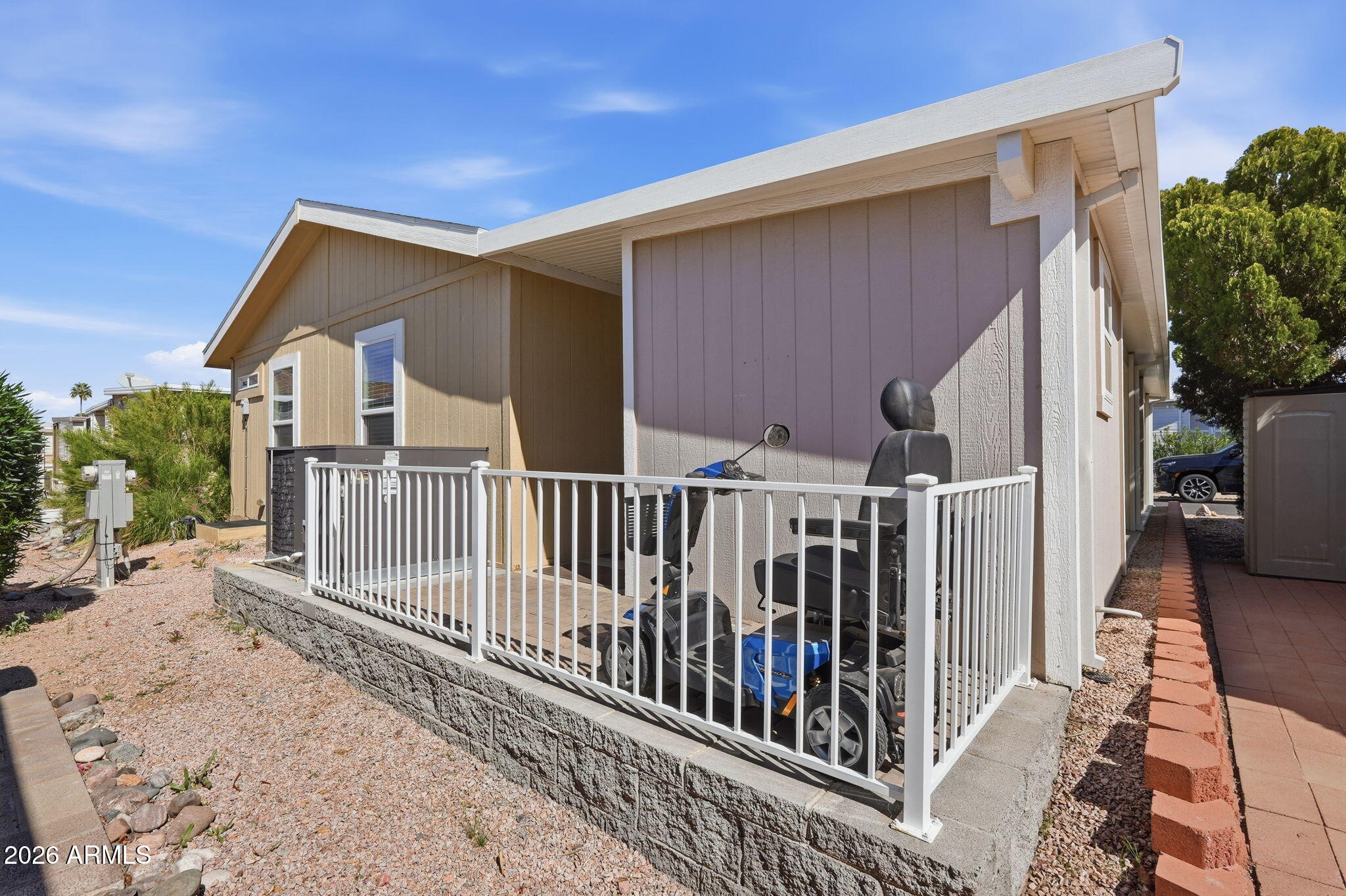 8865 East Baseline Road, Unit 1417 Mesa, AZ 85209 - Photo 28 of 47 a view of a house with wooden fence