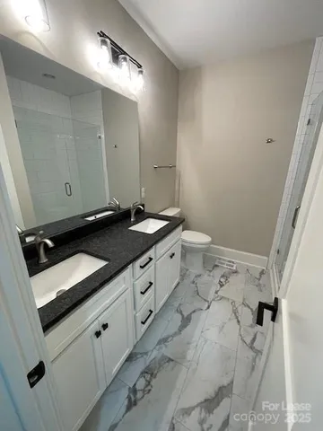 a bathroom with a sink and a toilet