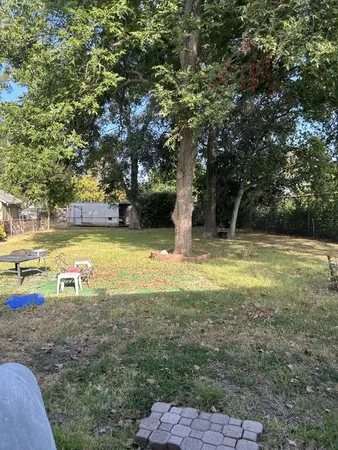 a view of a swimming pool with an outdoor space and seating area