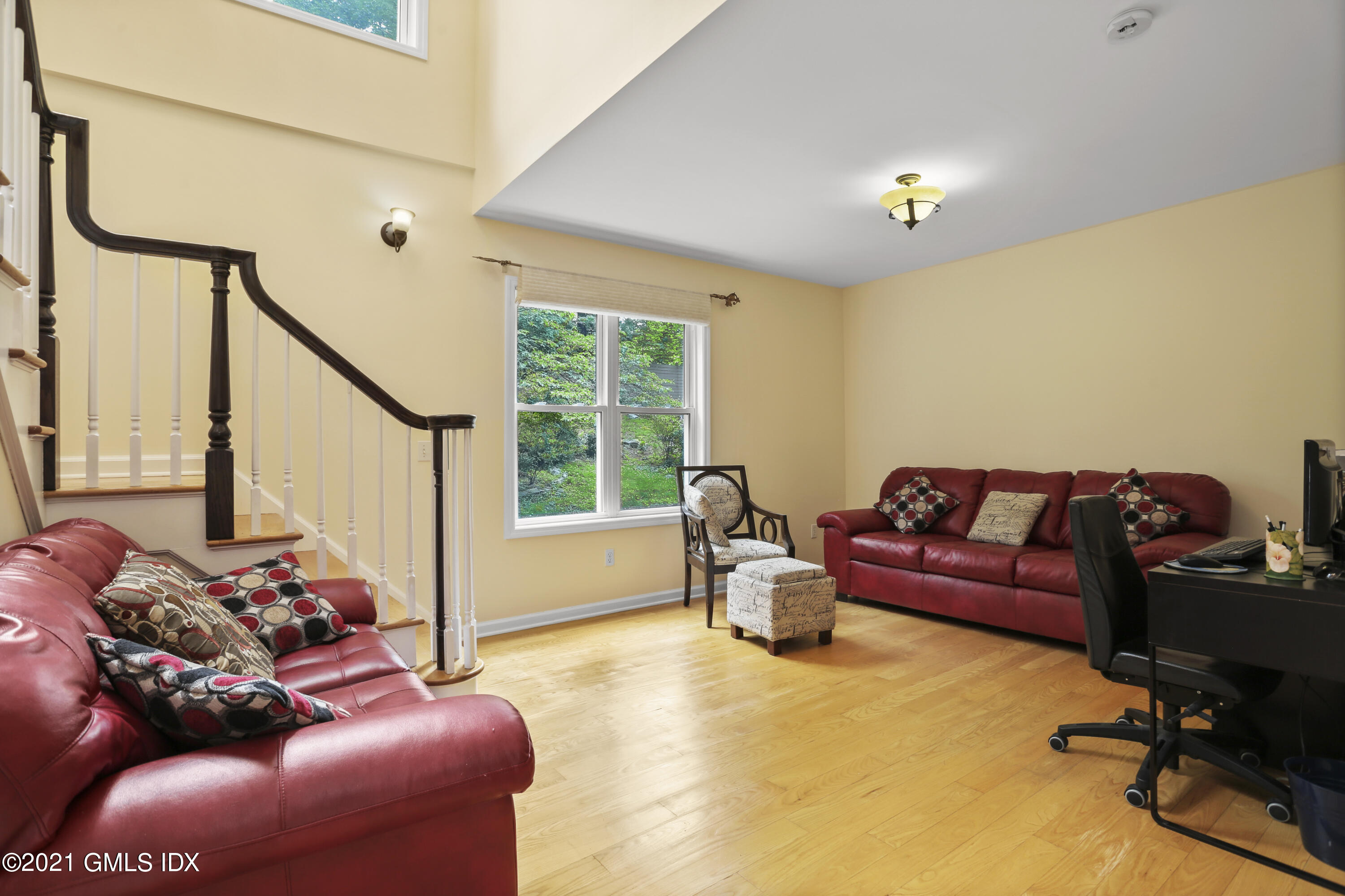 349 Riversville Road Greenwich, CT 06831 - Photo 15 of 28 a living room with furniture and a large window