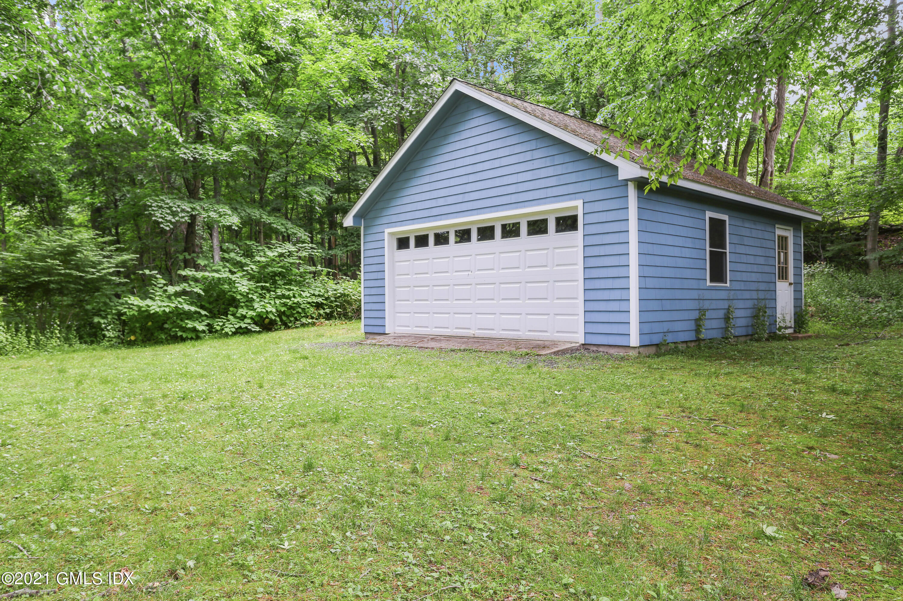 349 Riversville Road Greenwich, CT 06831 - Photo 23 of 28 a view of a house with backyard