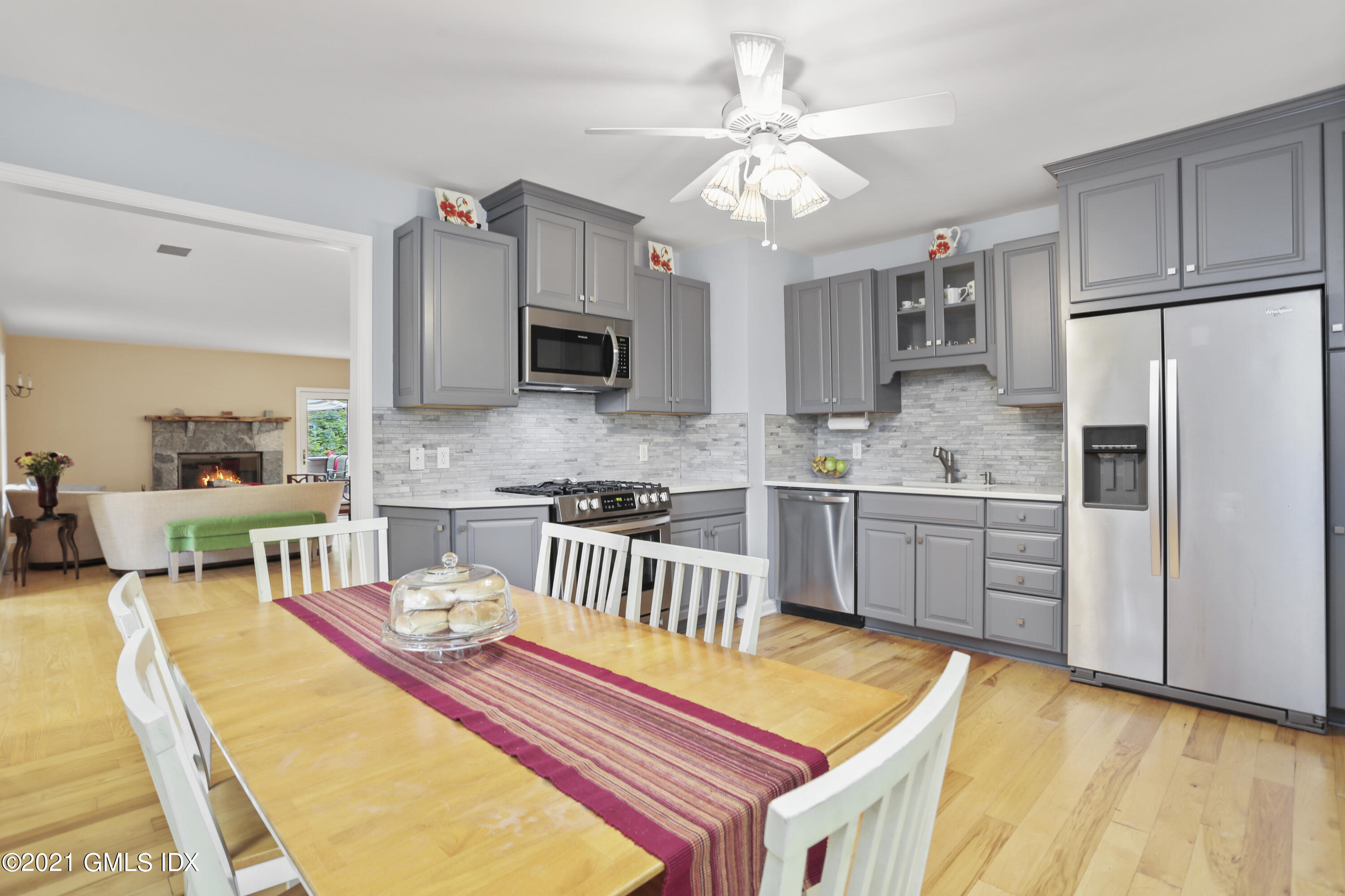 349 Riversville Road Greenwich, CT 06831 - Photo 4 of 28 a kitchen with stainless steel appliances granite countertop a sink cabinets and refrigerator
