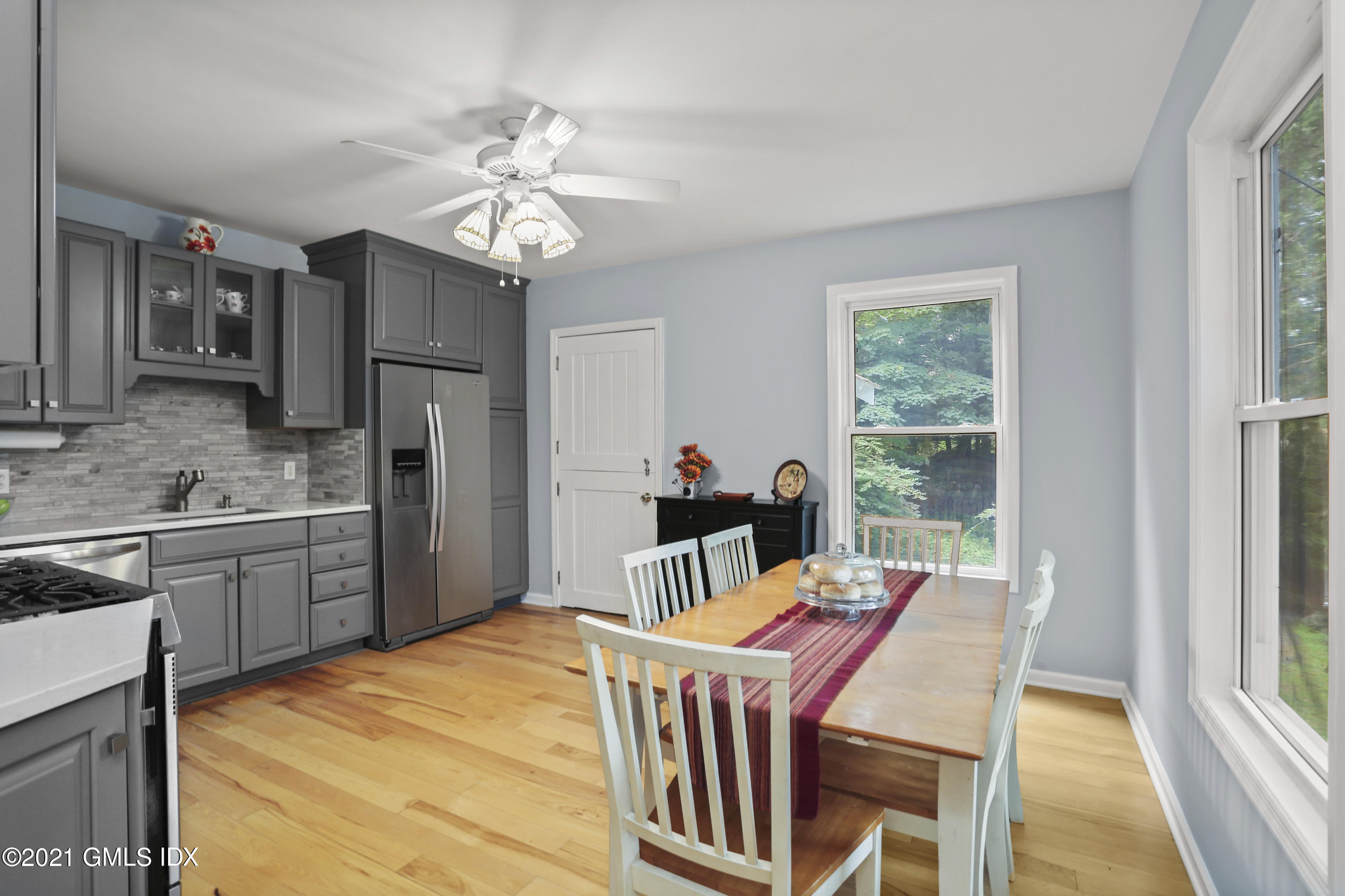 349 Riversville Road Greenwich, CT 06831 - Photo 6 of 28 a very nice looking kitchen with a table chairs refrigerator and a window