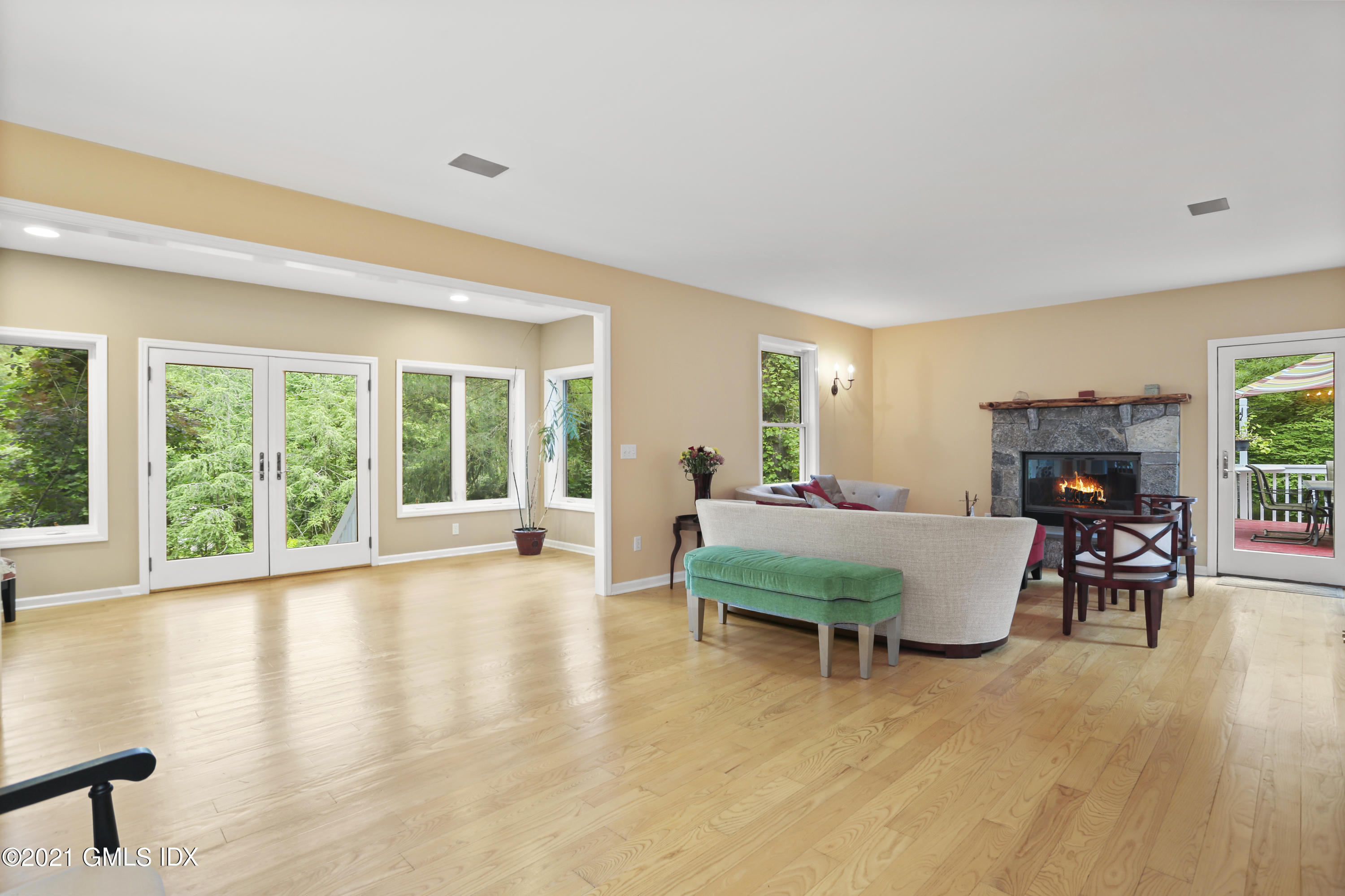 349 Riversville Road Greenwich, CT 06831 - Photo 7 of 28 a living room with furniture and a large window