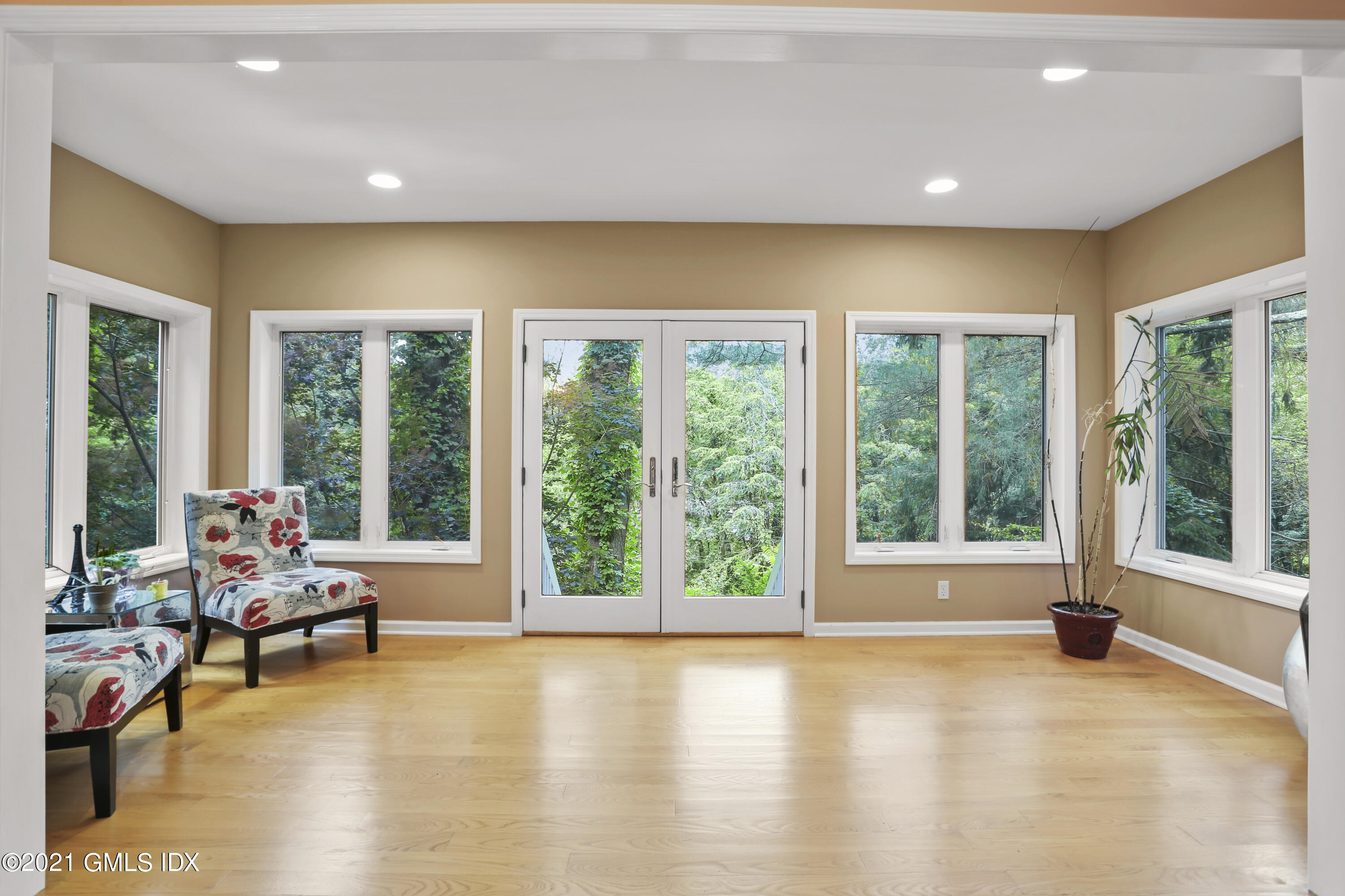 349 Riversville Road Greenwich, CT 06831 - Photo 8 of 28 a living room with furniture and floor to ceiling windows