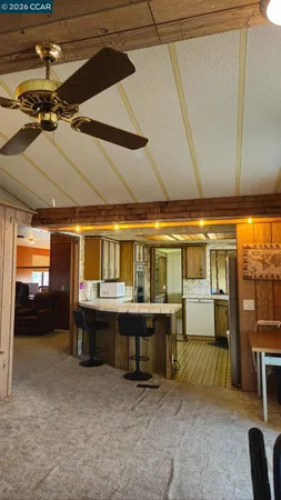 a kitchen with stainless steel appliances granite countertop a refrigerator and a stove