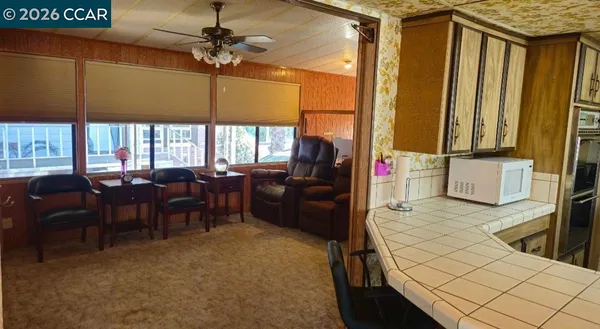a living room with lots of furniture and a chandelier