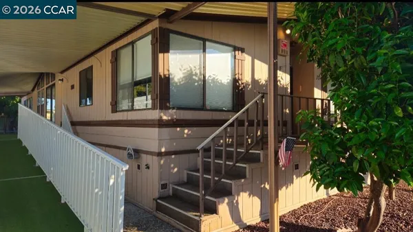 a kitchen with stainless steel appliances kitchen island granite countertop a sink and cabinets