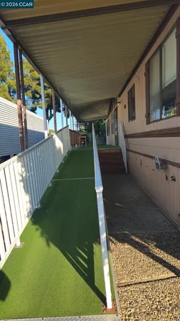 a living room with fireplace furniture and a window
