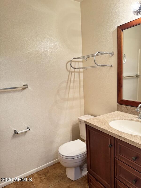 97 North Cooper Road, Unit 91 Chandler, AZ 85225 - Photo 21 of 28 a bathroom with a granite countertop toilet sink and a mirror