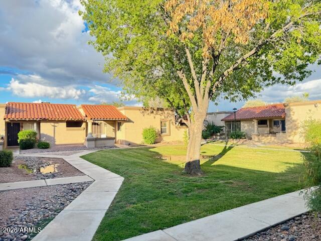 97 North Cooper Road, Unit 91 Chandler, AZ 85225 - Photo 27 of 28 a view of a house with swimming pool and sitting area