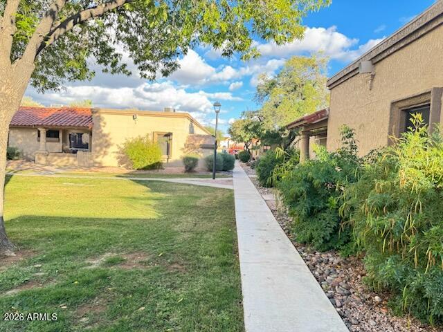 97 North Cooper Road, Unit 91 Chandler, AZ 85225 - Photo 28 of 28 a view of an swimming pool with a yard