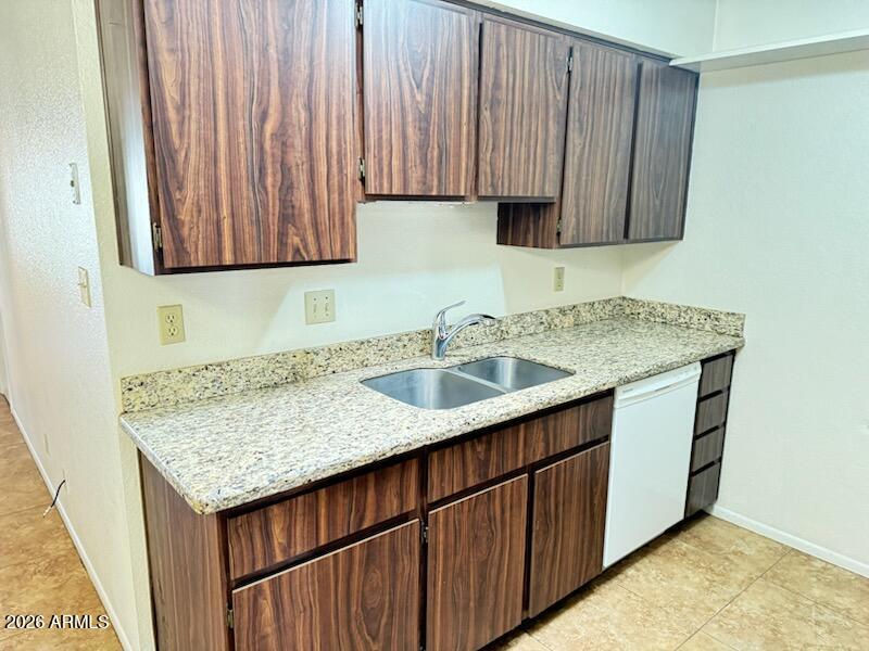 97 North Cooper Road, Unit 91 Chandler, AZ 85225 - Photo 4 of 28 a kitchen with a sink dishwasher and cabinets with wooden floor