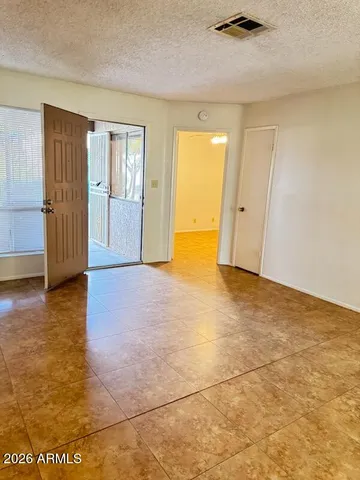 a view of an empty room and window