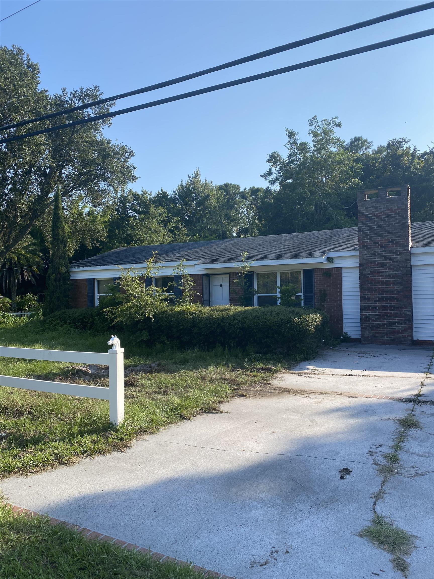 128 Argonaut Road St. Augustine, FL 32086 - Photo 2 of 2 a front view of a house with a yard