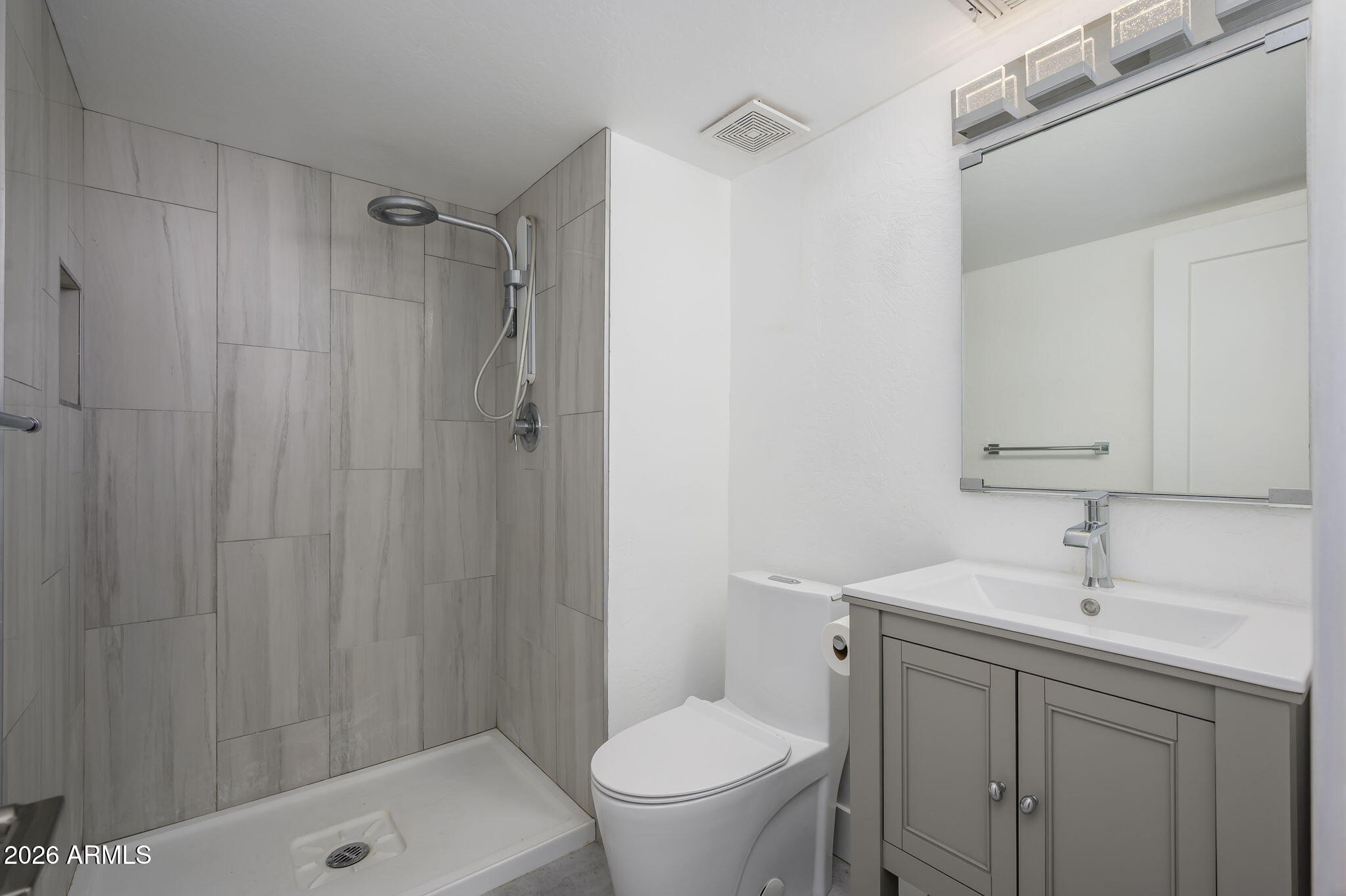 1004 East Osborn Road, Unit B Phoenix, AZ 85014 - Photo 11 of 22 a bathroom with a sink toilet and shower