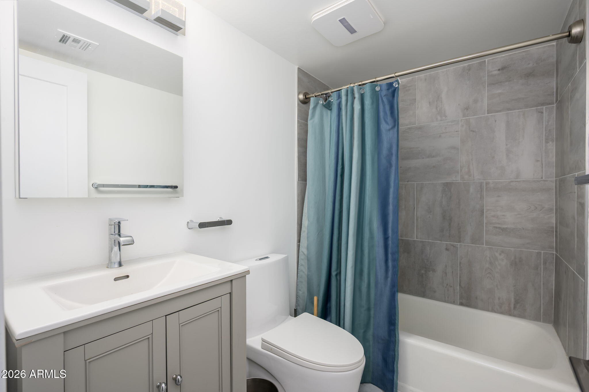 1004 East Osborn Road, Unit B Phoenix, AZ 85014 - Photo 14 of 22 a bathroom with a sink a toilet and shower