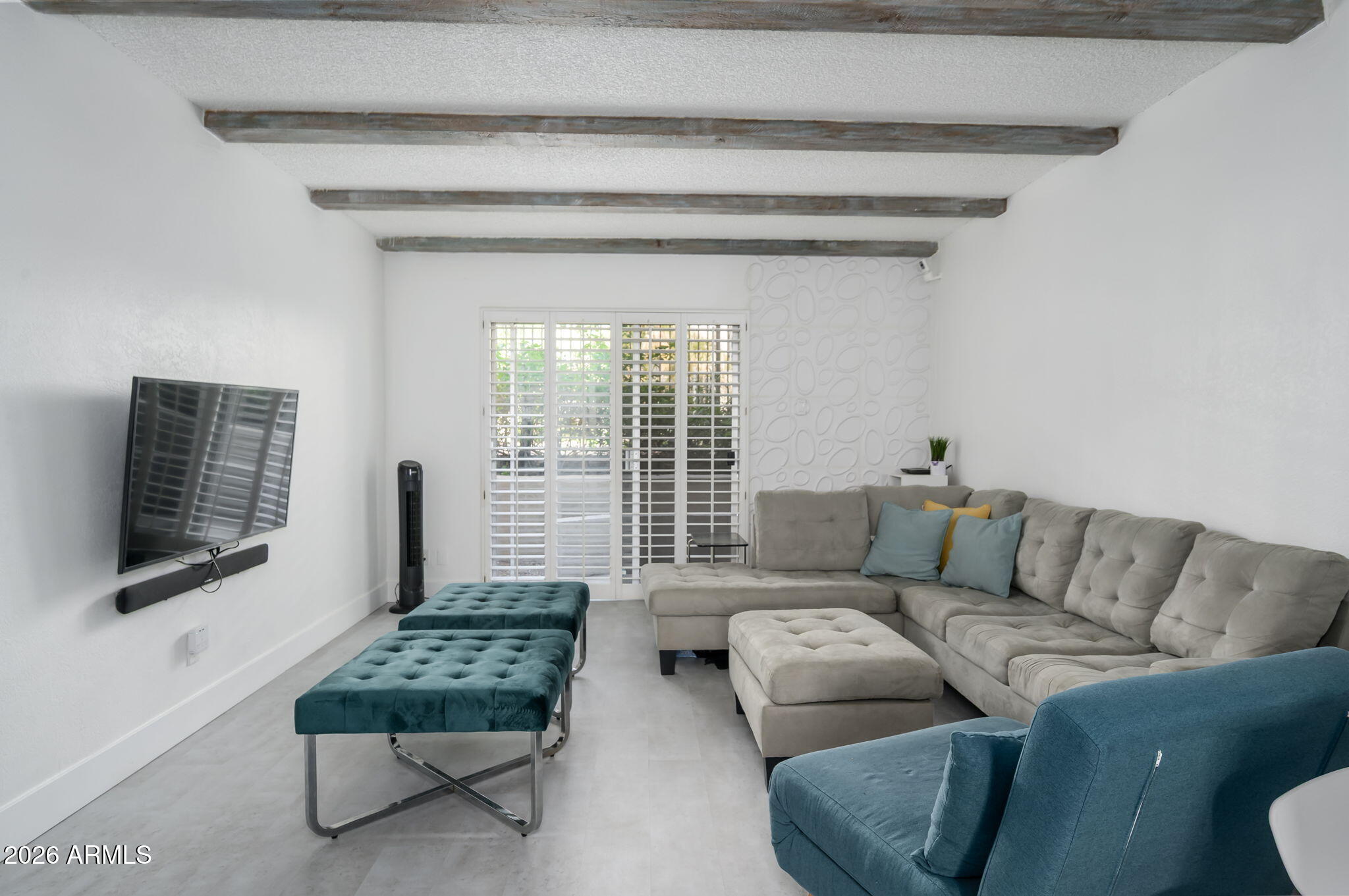 1004 East Osborn Road, Unit B Phoenix, AZ 85014 - Photo 4 of 22 a living room with furniture and a window