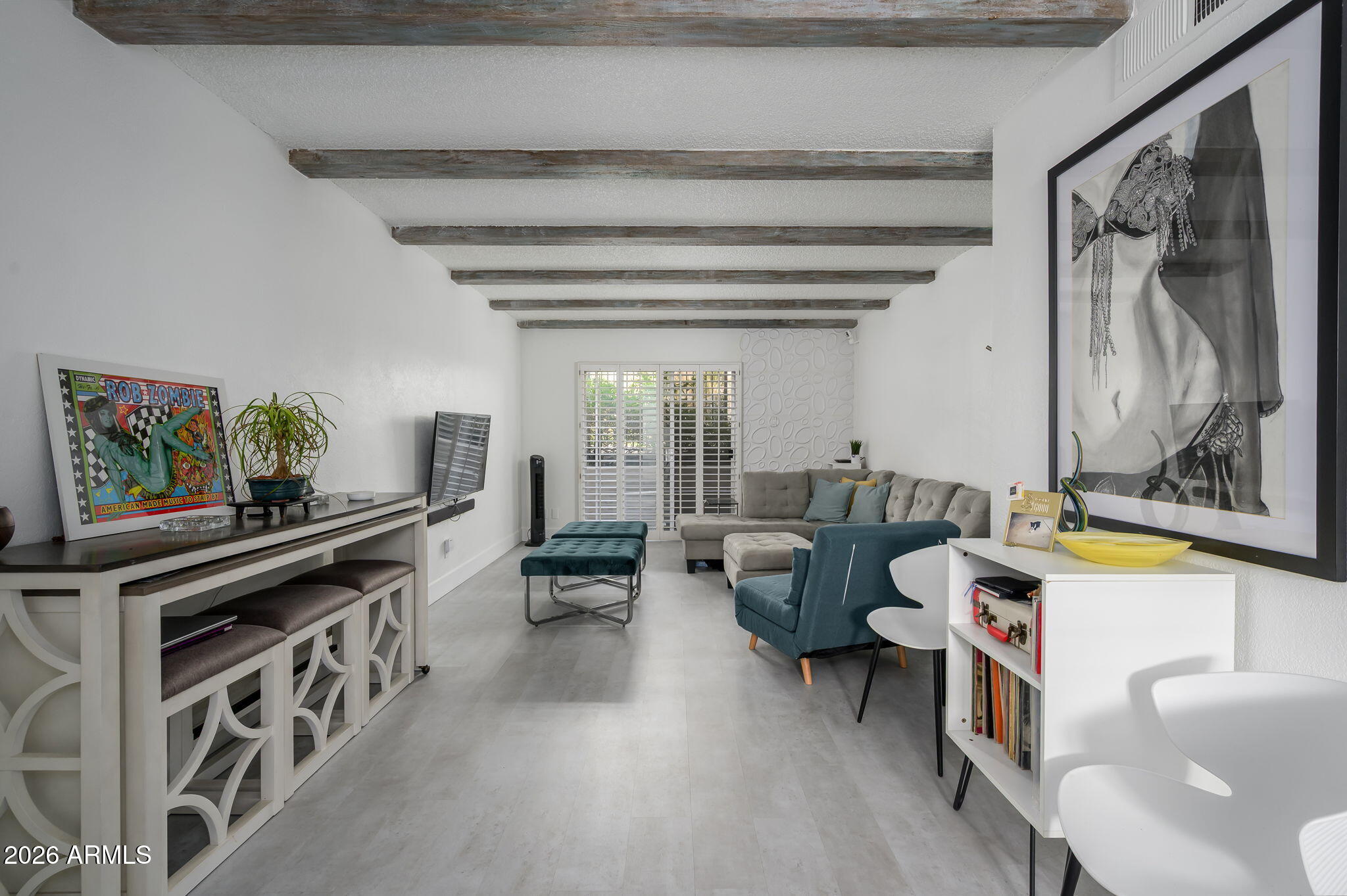 1004 East Osborn Road, Unit B Phoenix, AZ 85014 - Photo 5 of 22 a living room with furniture and a flat screen tv