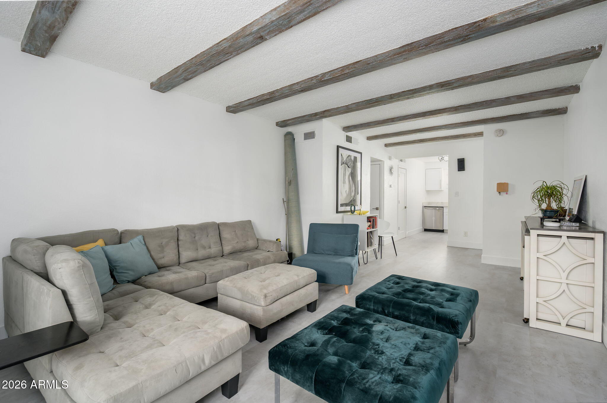 1004 East Osborn Road, Unit B Phoenix, AZ 85014 - Photo 6 of 22 a living room with furniture and a couch