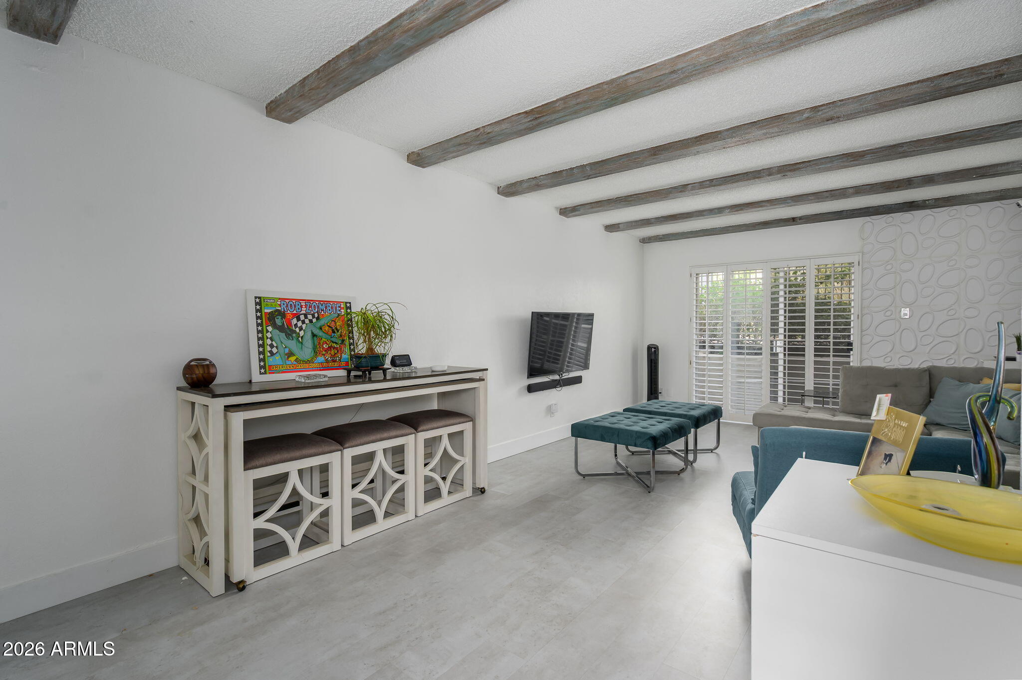 1004 East Osborn Road, Unit B Phoenix, AZ 85014 - Photo 8 of 22 a living room with furniture and a flat screen tv