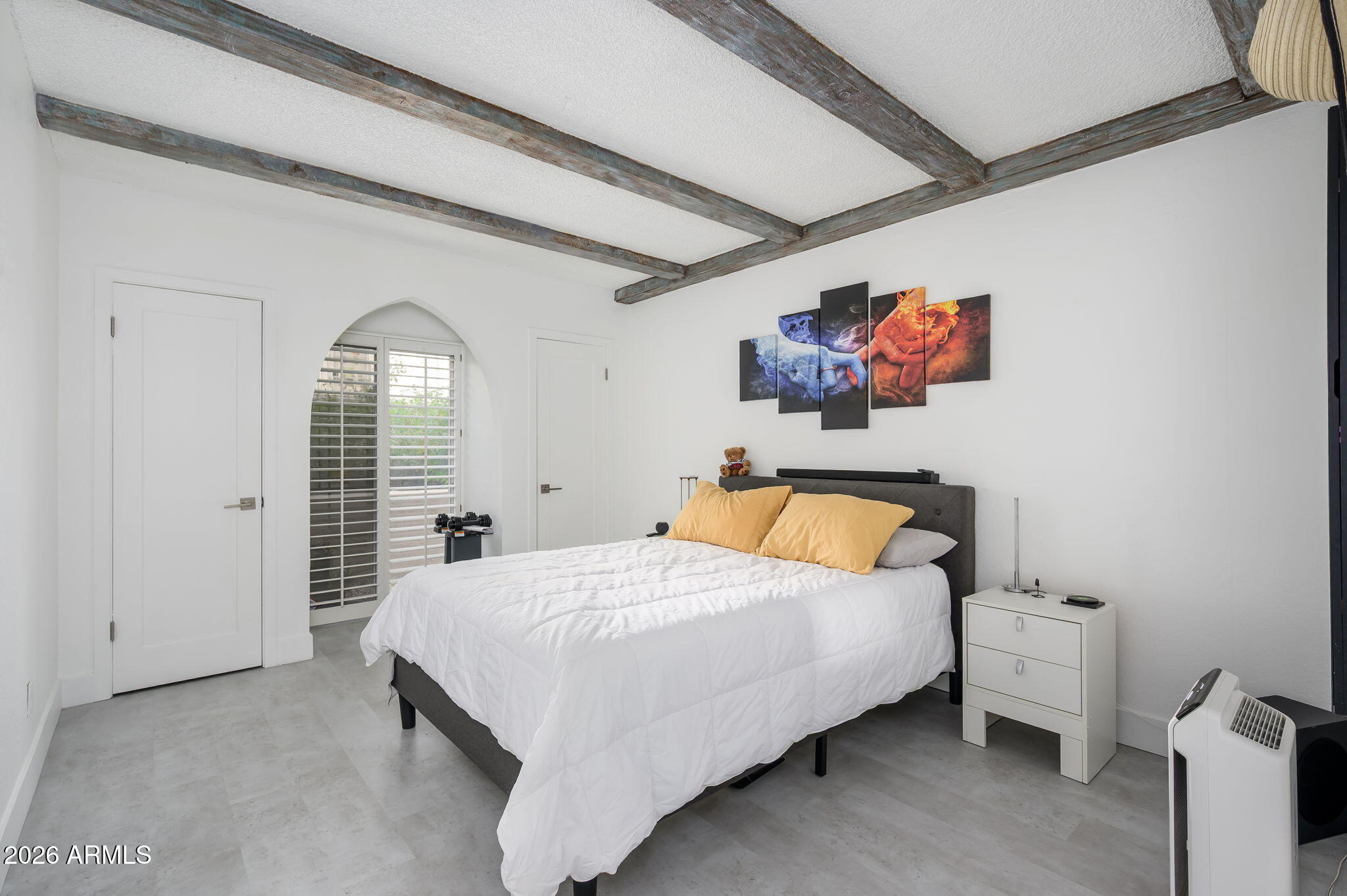 1004 East Osborn Road, Unit B Phoenix, AZ 85014 - Photo 9 of 22 a bedroom with a bed and a large window